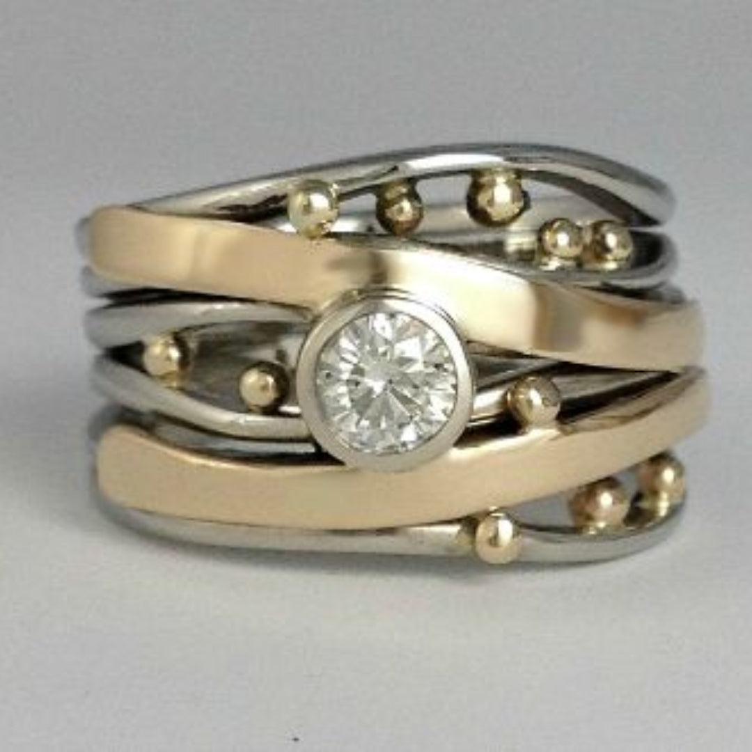 Elegant Ring Adorned with Zirconia in Antique Gold Tone